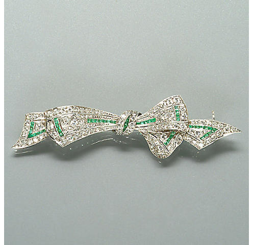 An early 20th century diamond and emerald brooch