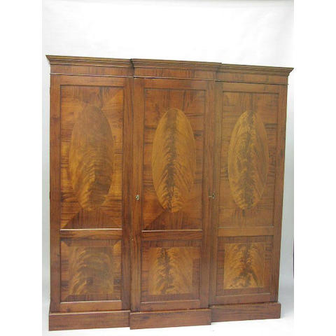 A Regency mahogany and crossbanded breakfront wardrobe