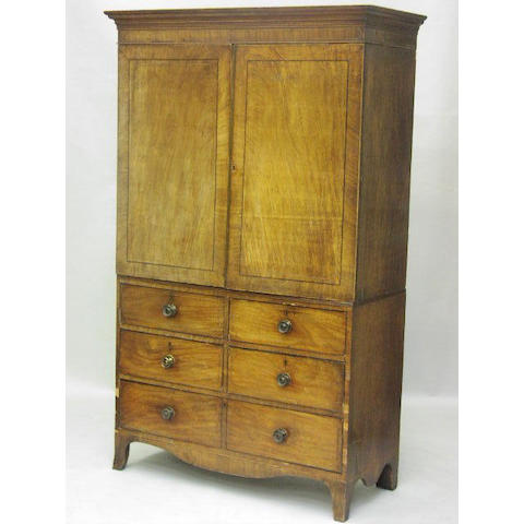 A Regency mahogany and boxwood and ebony strung linen press