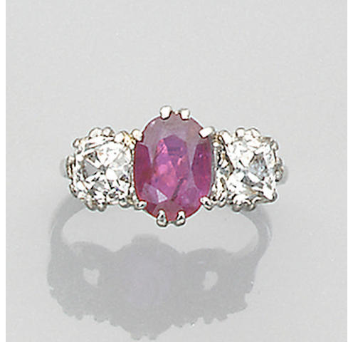 A diamond and ruby three stone ring