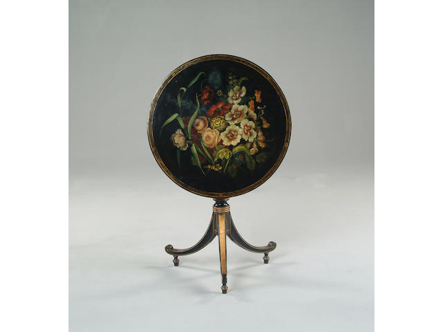 An early 19th century papier mach&#233; ebonised gilt and polychrome decorated occasional table