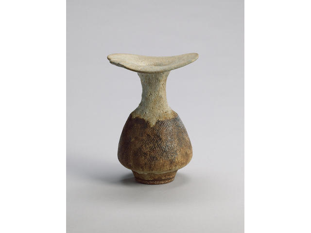 Dame Lucie Rie a flaring lip Vase with brown body, circa 1976 Height 8 1/4in. (21cm)