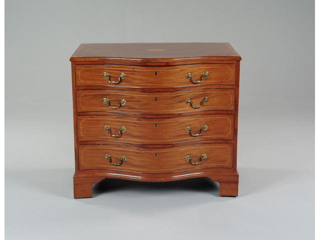 A George III serpentine chest