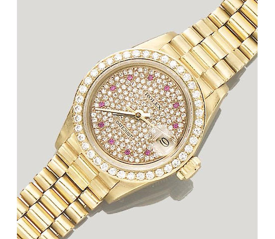 A diamond and ruby-set wristwatch by Rolex