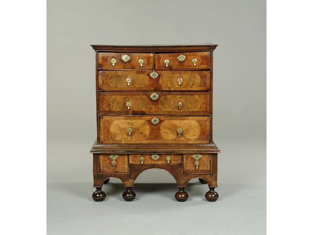 A William and Mary burr yew and walnut chest on stand