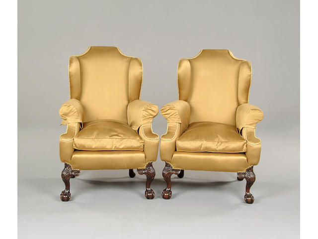 A pair of George III style upholstered armchairs