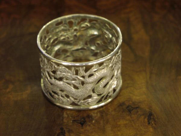 A set of four Chinese napkin rings, (4)