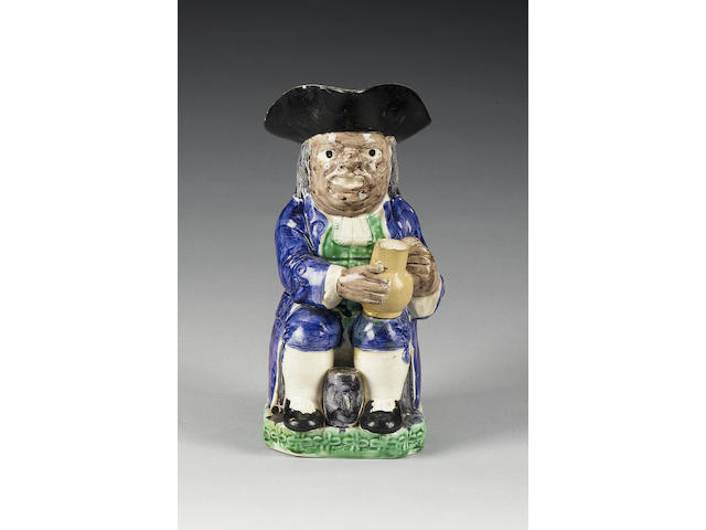 A creamware 'Collier' Toby jug, circa 1790,