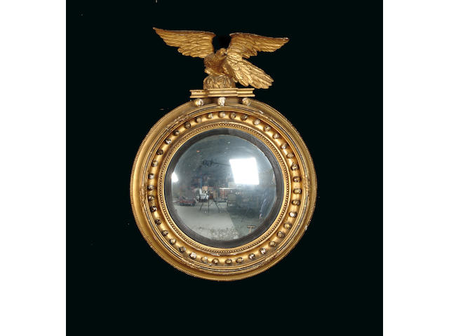 A Regency gilt carved and composition convex mirror