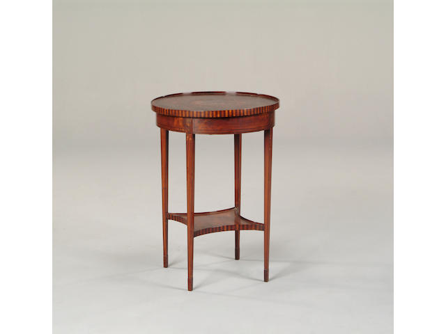 An Edwardian satinwood occasional table