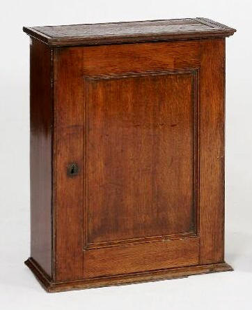 A late 18th Century oak spice cupboard of rectangular form,