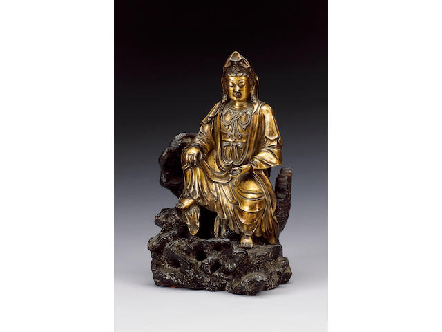An elegant gilt bronze figure of Guanyin,