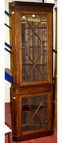 A floor standing mahogany corner cabinet