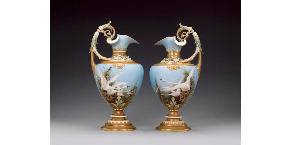 A superb pair of Royal Worcester ewers by Charley Baldwyn dated 1900