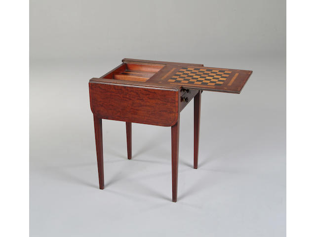 A George III mahogany crossbanded Pembroke games table