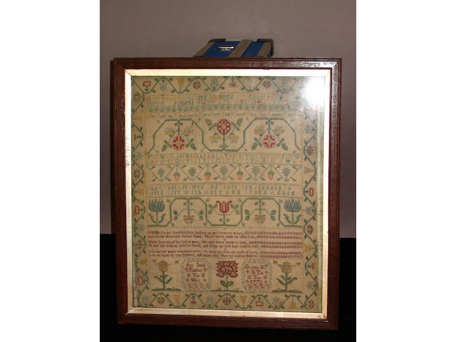 A George III sampler finely worked in silk threads to linen ground,