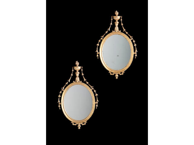 A pair of 19th century gilt carved and composition mirrors