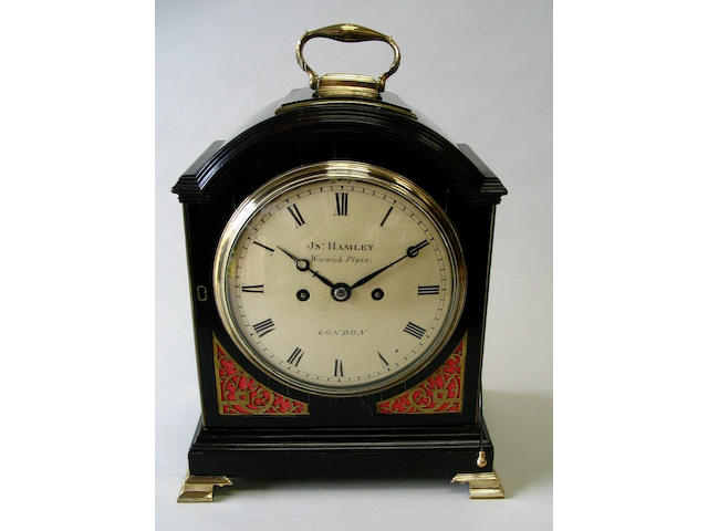 A George III ebonised and brass mounted bracket clock