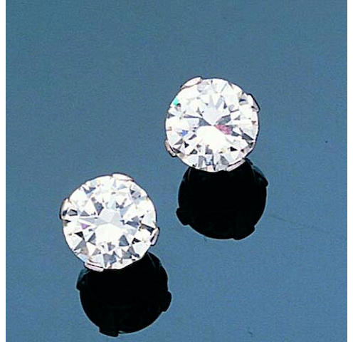 A pair of diamond single-stone earrings