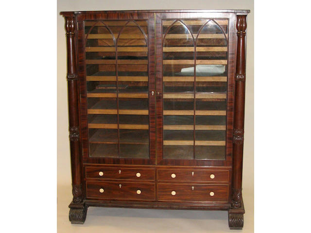 An unusual George IV figured mahogany music cabinet of Gillow quality