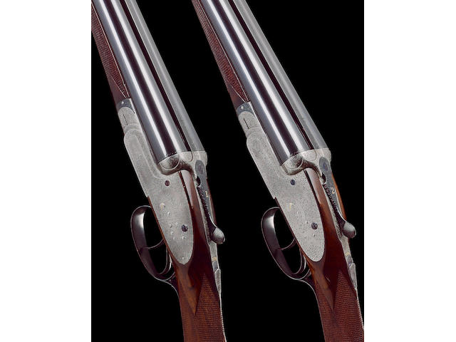 A fine pair of 12-bore (2&#190;in) 'Grade L60' sidelock ejector guns by W.W. Greener, no. 56992/3 In their brass-mounted oak and leather case