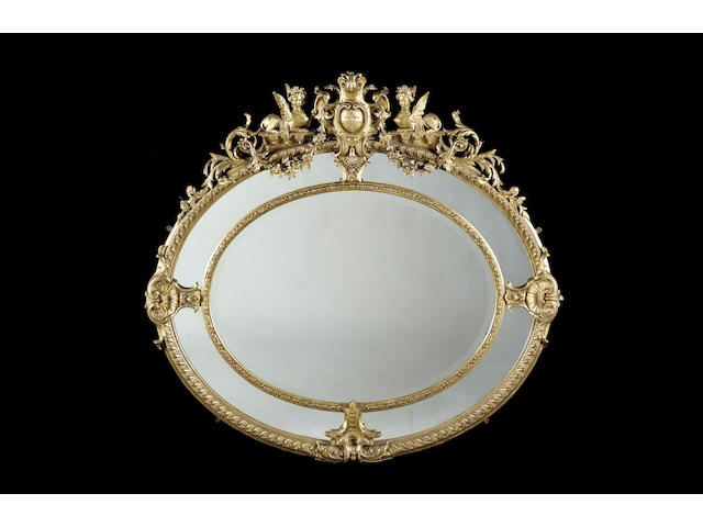 A late 19th century gilt composition oval mirror