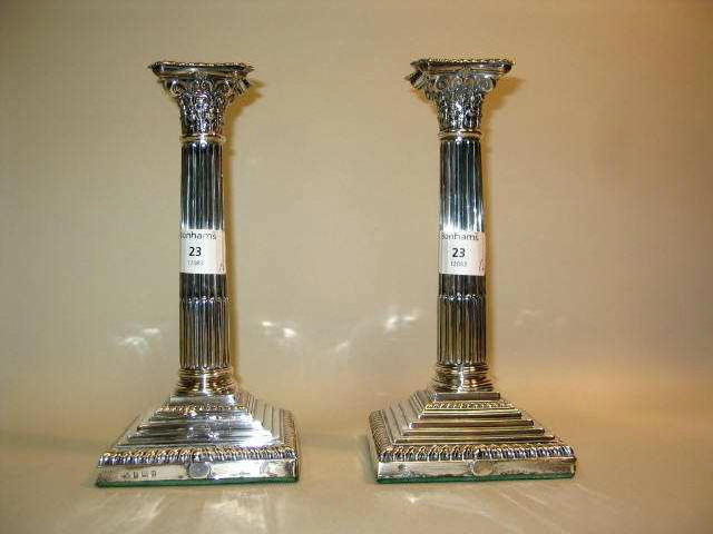 A pair of candlesticks,  by Elkington and Co,   Birmingham 1928,