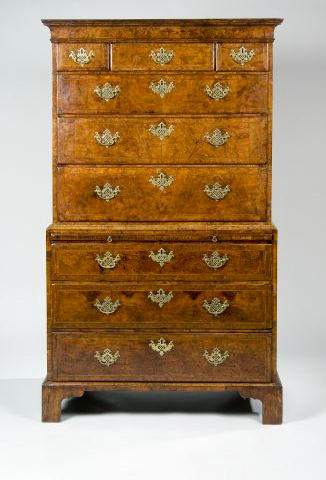 A fine George I figured walnut and feather crossbanded and chest on chest,