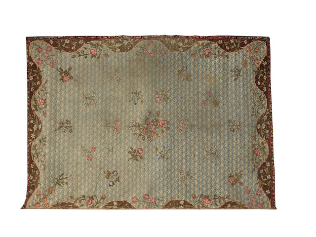 An 18th century Axminster carpet England, 18 ft x 13 ft 1 in (549 x 399 cm) lacking borders