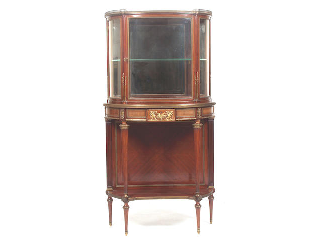An early 20th Century Empire style mahogany and ormolu mounted half round display cabinet