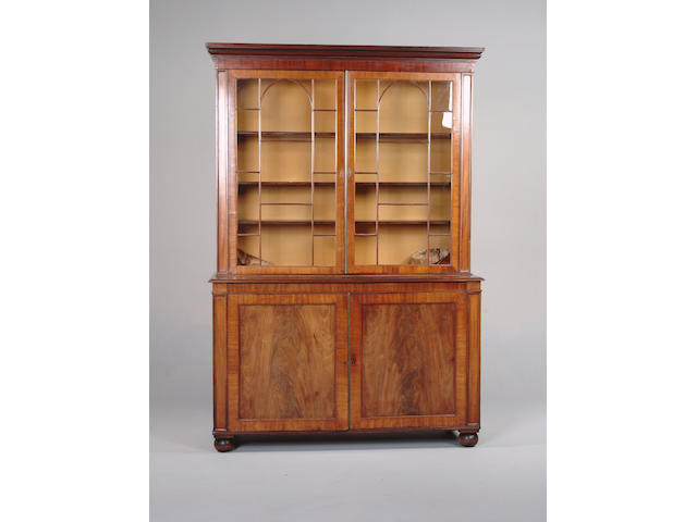 An early 19th century mahogany bookcase cabinet