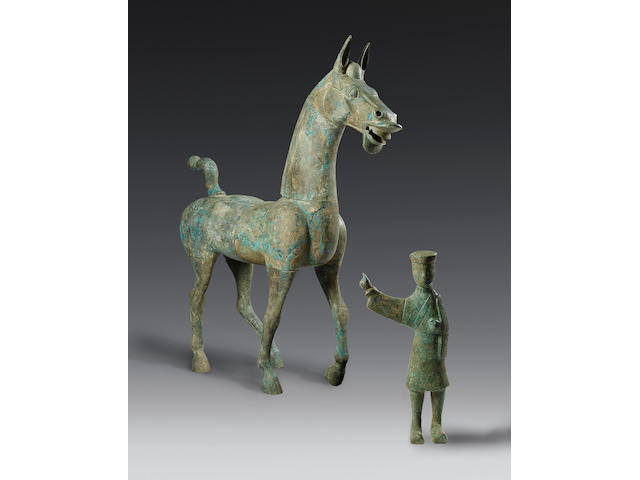 A massive and very rare bronze striding horse and groom Han Dynasty, probably Eastern