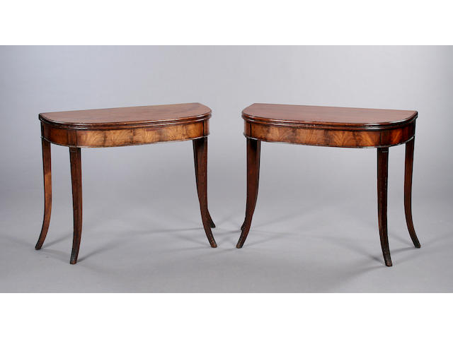 A pair of Regency mahogany fold-over side tables