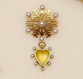 A late Victorian seed pearl and rock crystal heart shaped pendant, (2)