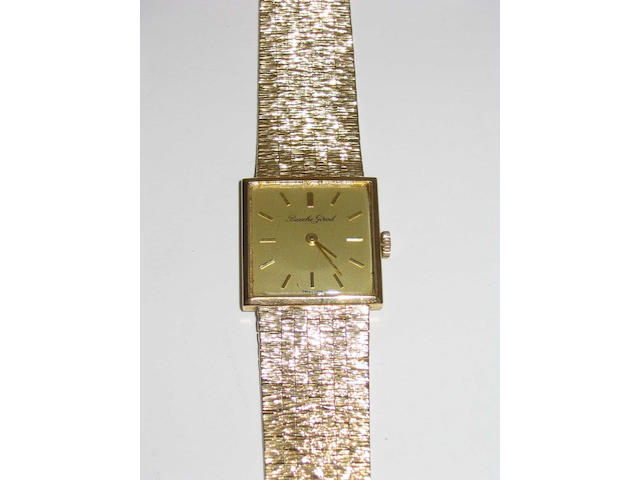 Beuche Girod: a mid-size 9 carat gold wristwatch,