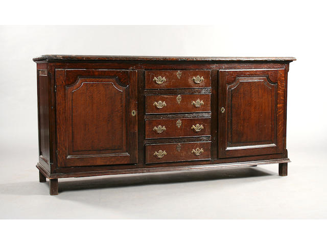 A mid 18th Century and later oak dresser base