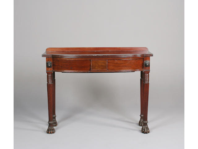 A mahogany bow front serving table