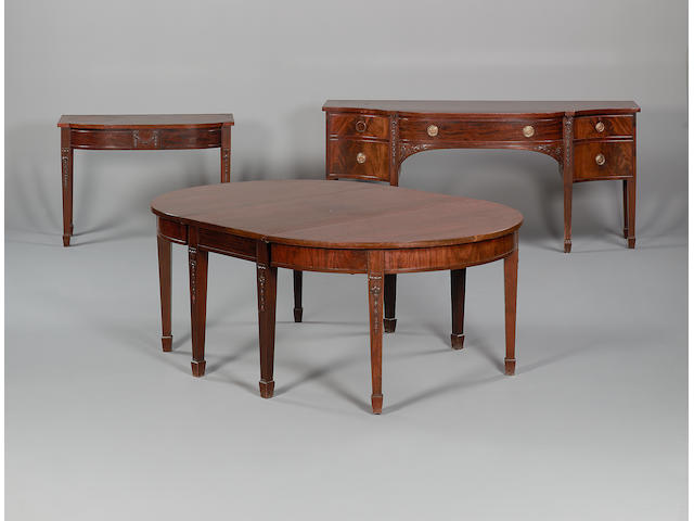 A late 19th century mahogany dining room suitein the George III style