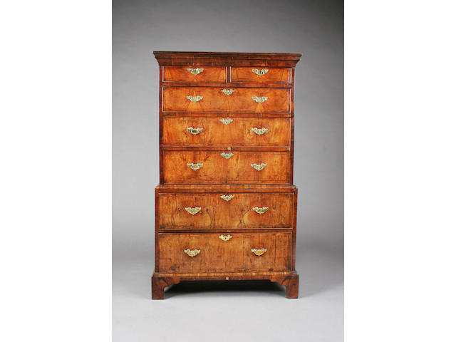 A small George I/early George II figured walnut and line inlaid chest-on-chest