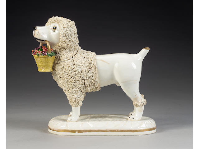 An important John and Rebecca Lloyd of Shelton model of a poodle with basket of fruit in its mouth,