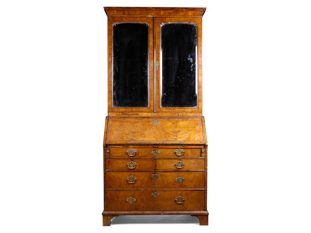 A George I walnut crossbanded and featherbanded bureau bookcase,