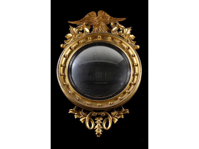 A Regency giltwood convex wall mirror,