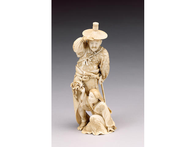 A fine stained ivory okimono of a Samurai,