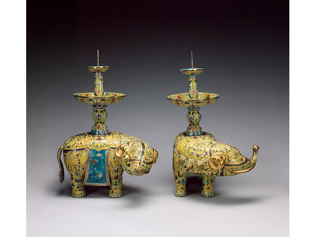 A very decorative pair of yellow-ground, cloisonn&#233; enamel elephants;