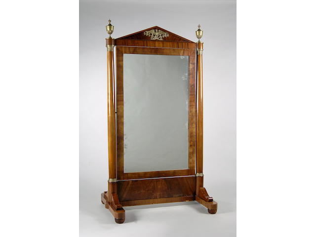 A 19th Century Empire style mahogany and brass mounted cheval mirror,