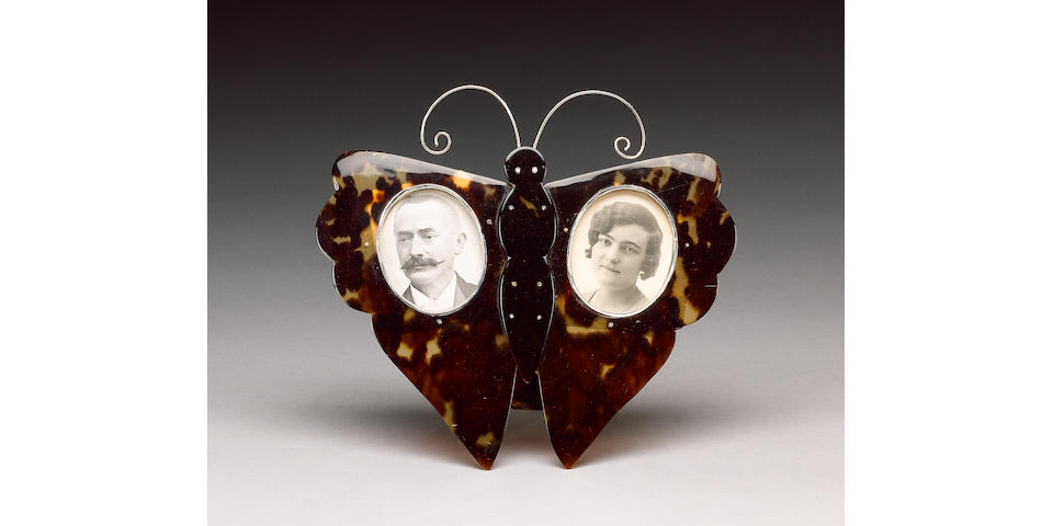 An Edwardian tortoiseshell butterfly double photograph frame,