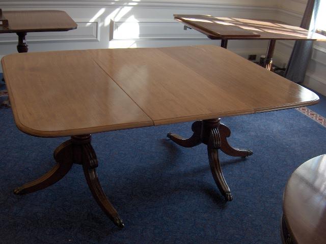A Regency style mahogany twin pedestal dining table