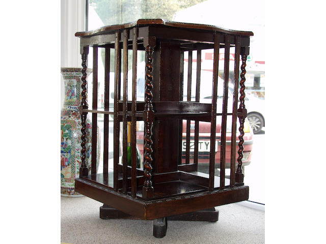 A circa 1920s or 1930s oak revolving bookcase,