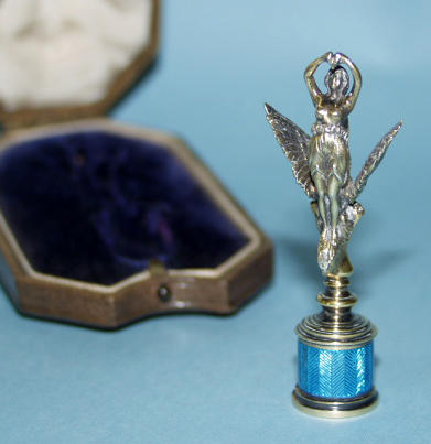 An early 20th century silver gilt and blue enamel seal