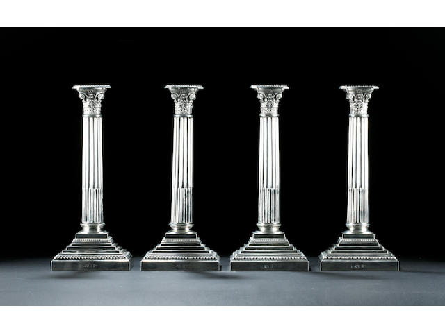 A set of four Corinthian column candlesticks by Walker & Hall Chester 1906,